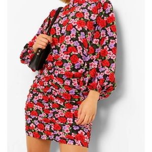 Brand new dress from Boohoo, size 12 and it is a multi colored dress.  Bodycon